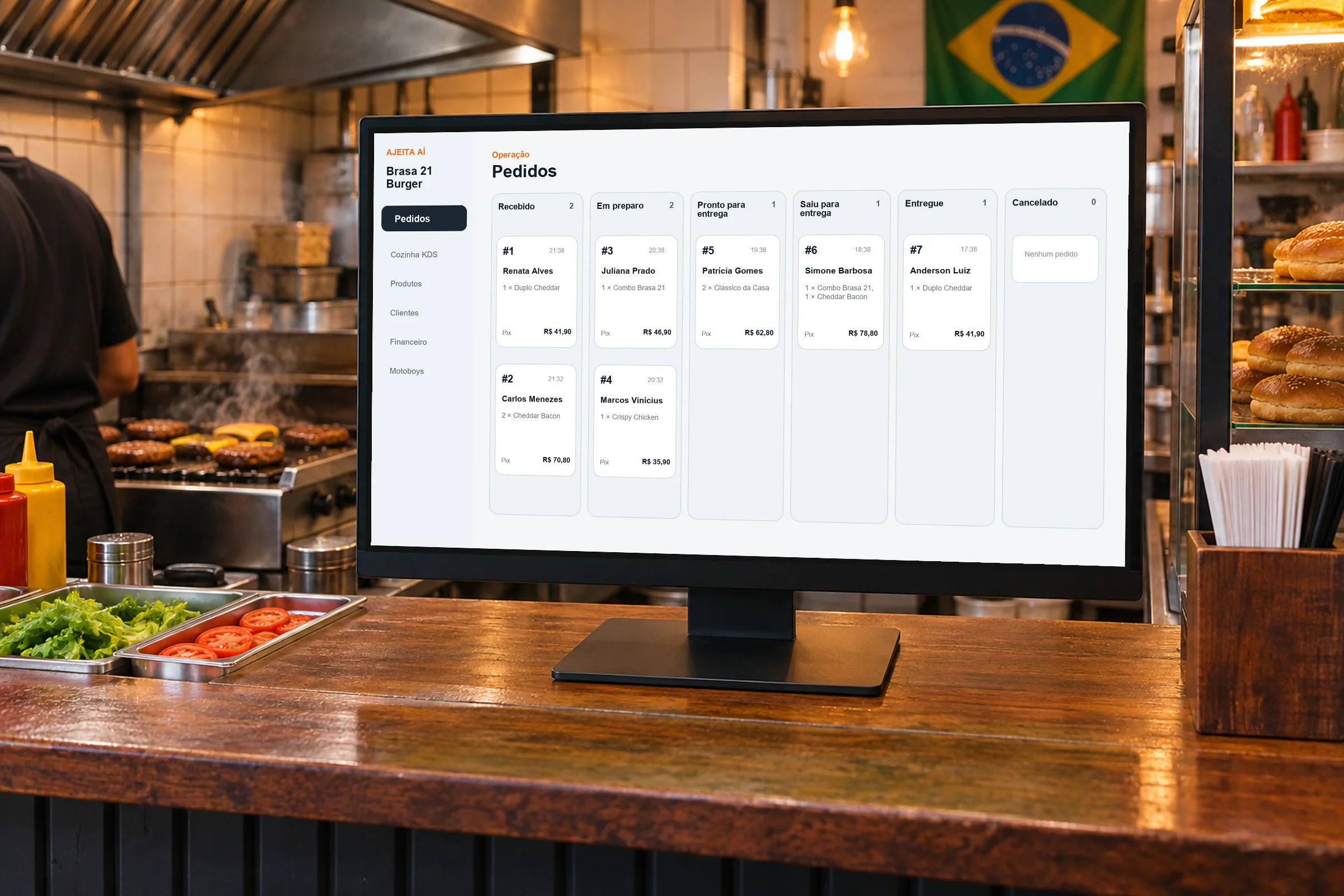 Painel de pedidos da loja Brasa 21 Burger aberto em um monitor no balcão